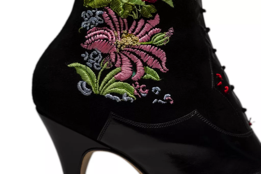 Here you can see a close up of the embroidery worked into a leg panel on the Florica black suede boot. In pinks, greens and a grey blue floral design.